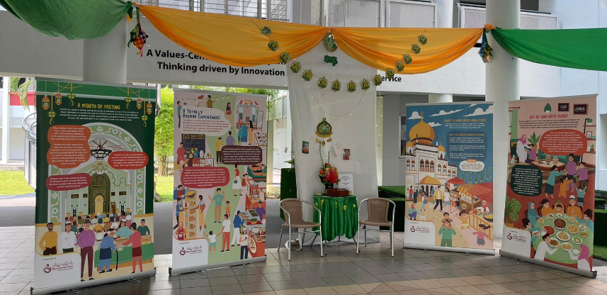 Four colorful Ramadan-themed display banners arranged in a decorated indoor space with gold and green fabric draping.